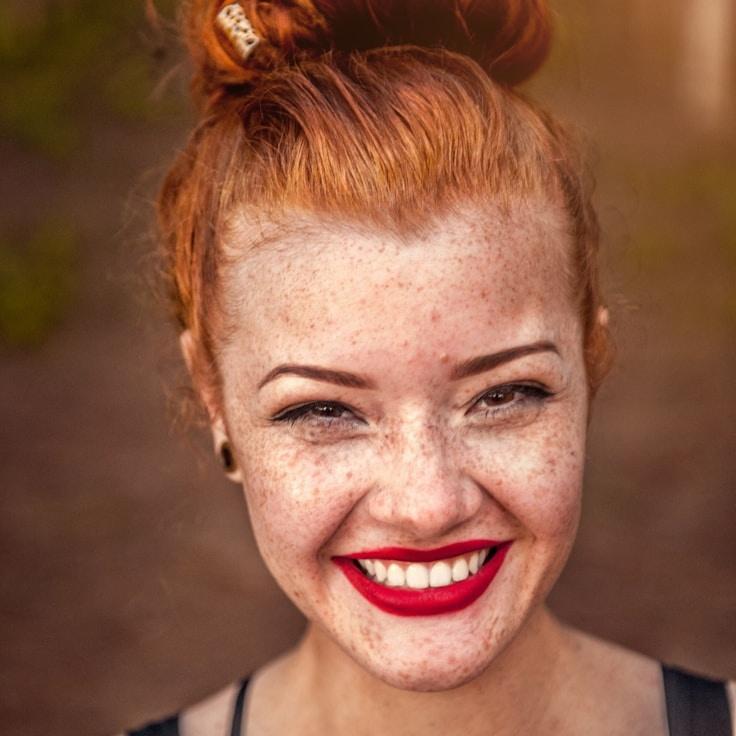 Alex Kim, Lead Design Curator at Crystal Garden Association, reviewing corporate floral arrangements